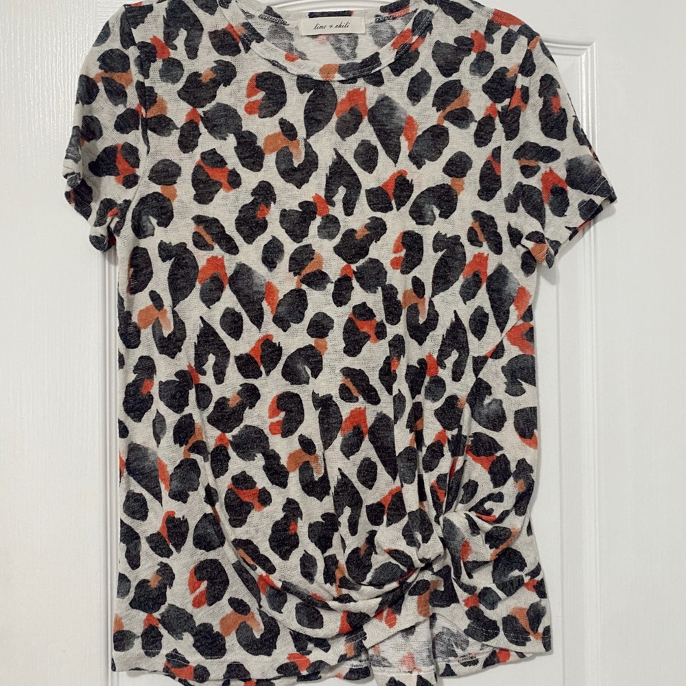 A casual cheetah print top with a cute knot detailing in the front